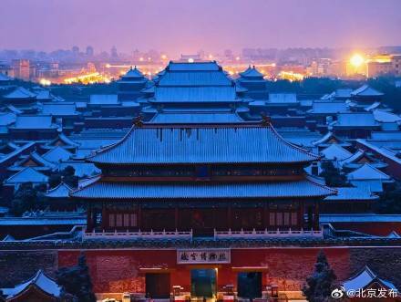 Snow blankets the vermilion walls; 