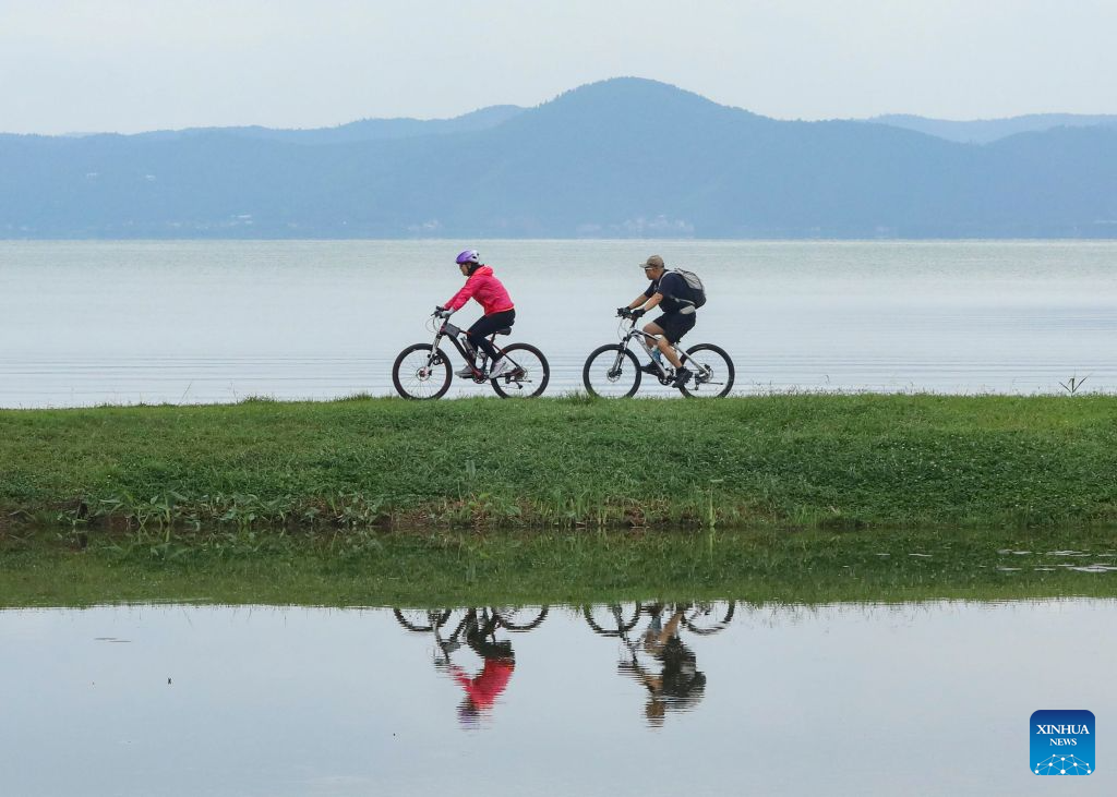 Tourists enjoy themselves in China's Yunnan